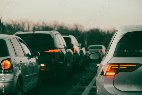 traffic. cars caught in the crowd. photo taken in the evening. people in traffic returning from work photo