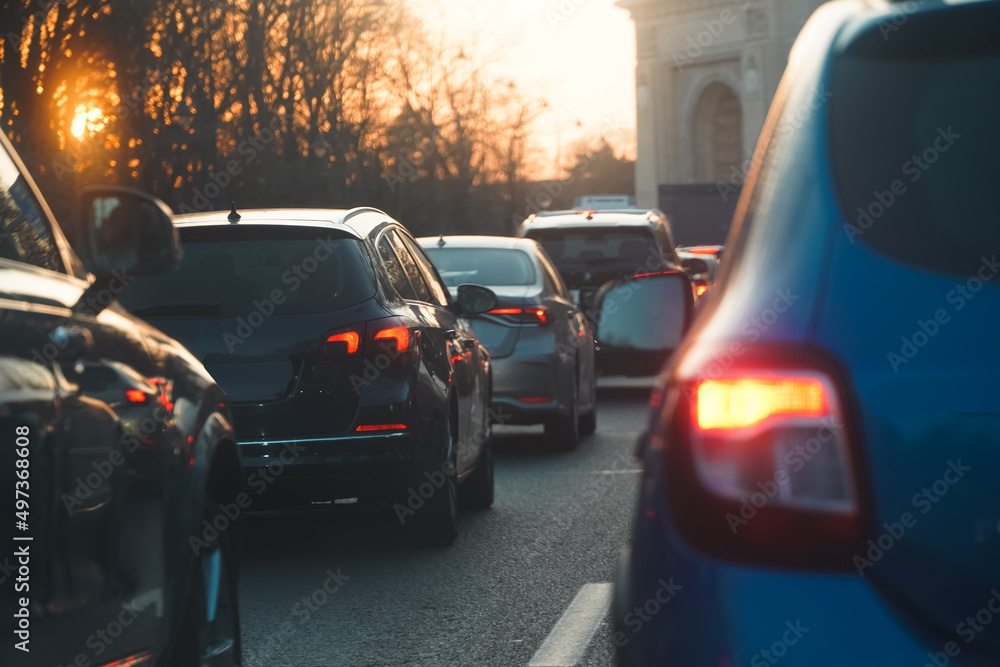 traffic. cars caught in the crowd. photo taken in the evening. people in traffic returning from work