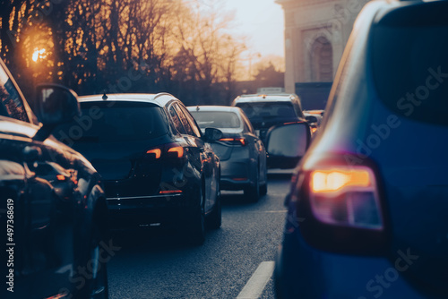 traffic. cars caught in the crowd. photo taken in the evening. people in traffic returning from work photo