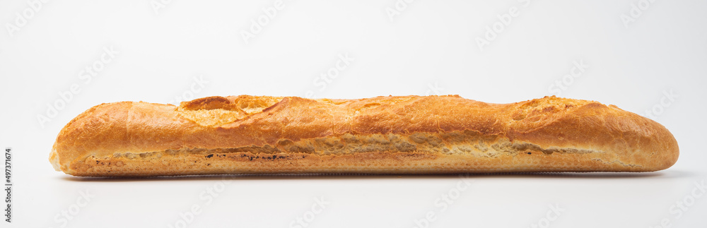 freshly baked baguette  on white background, side view