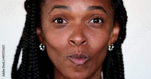 African woman grimacing making funny faces to camera. Expressive fun portrait