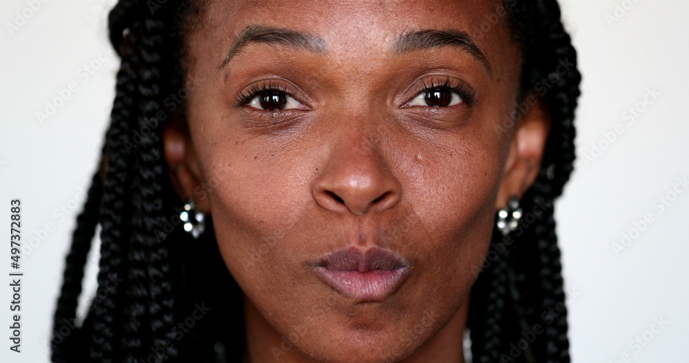 African woman grimacing making funny faces to camera. Expressive fun portrait African woman grimacing making funny faces to camera. Expressive fun portrait