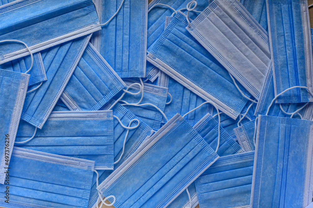 a lot of blue medical masks, top view a lot of blue medical masks, top view