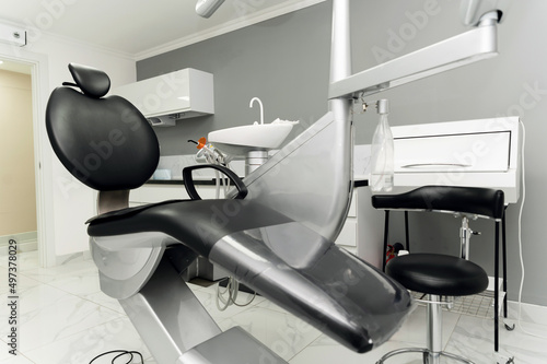 modern dental office. dental chair and equipment with tools for dental treatment. dental clinic.