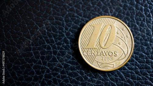 ten brazilian cents in black background