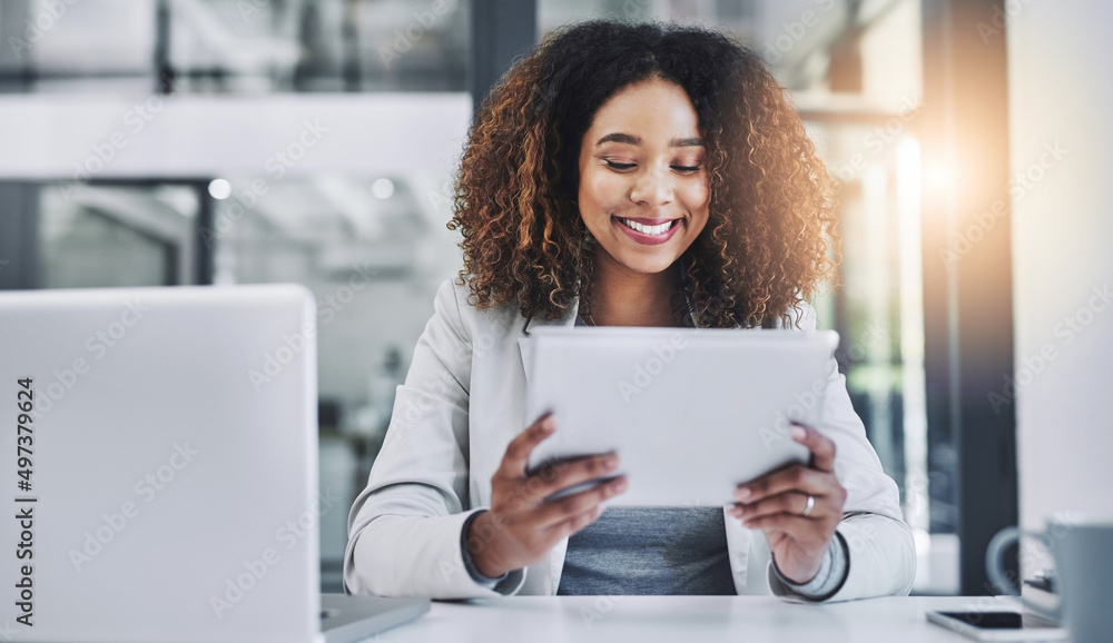 Shes got the tools to bridge over any business boundaries. Shot of a young businesswoman using a digital tablet in an office. Shes got the tools to bridge over any business boundaries. Shot of a young businesswoman using a digital tablet in an office.