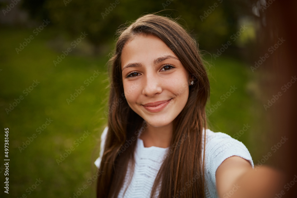 My selfie game is on point. Cropped portrait of a young girl taking selfies in the park.