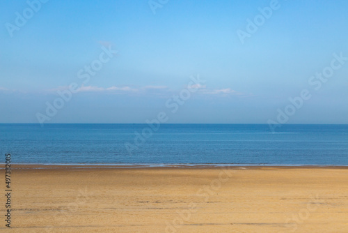 Fototapeta Naklejka Na Ścianę i Meble -  An Empty Sandy Beach on a Sunny Morning
