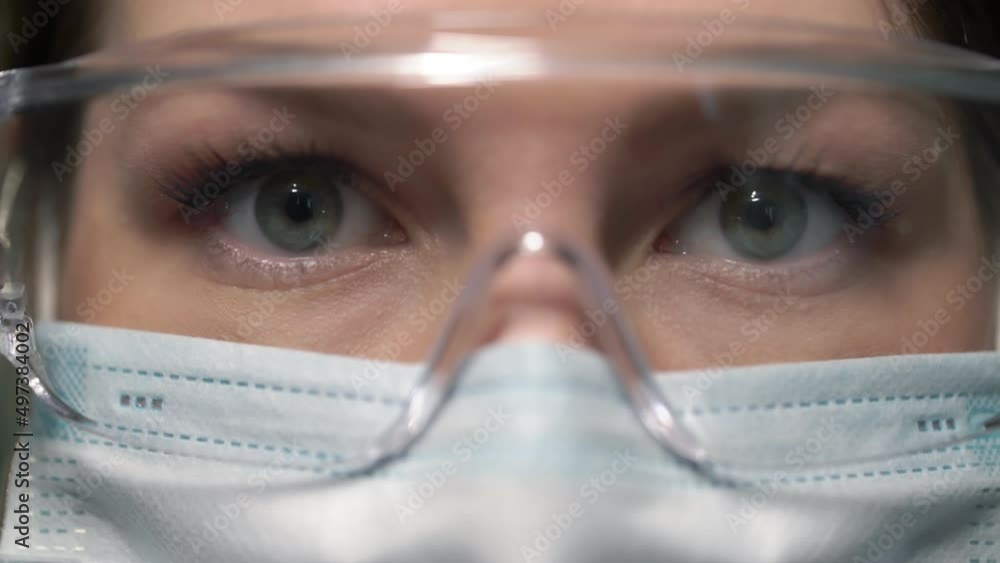Young woman doctor or nurse working. Girl in medical mask, glasses and shield. Young woman doctor or nurse working. Girl in medical mask, glasses and shield.