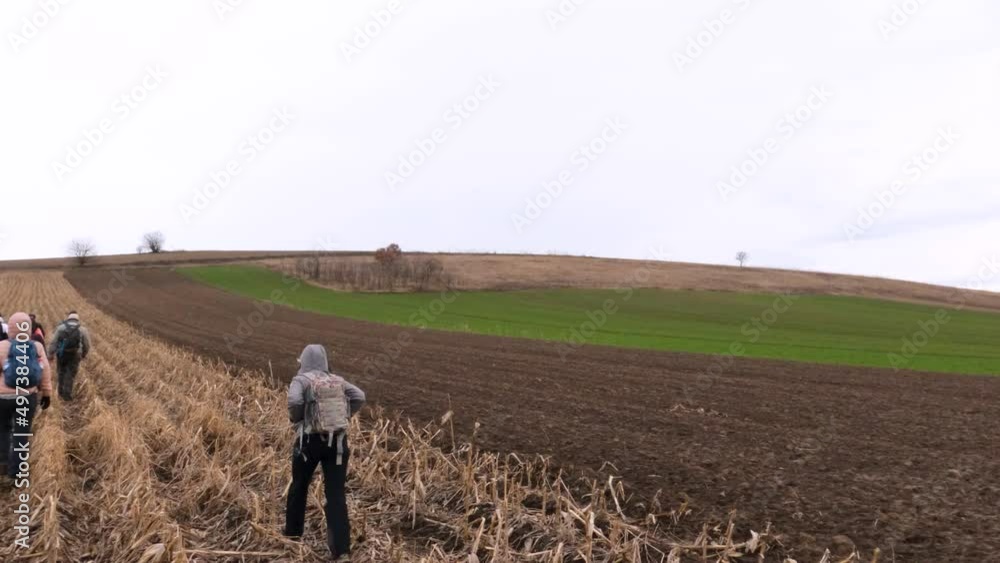 Group of hikers with backpacks walking on rural trail. Active people outdoor. Healthy lifestyle. Cloudy spring day. Back view. Unrecognizable people.
Group of hikers with backpacks walking on rural trail. Active people outdoor. Healthy lifestyle. Cloudy spring day. Back view. Unrecognizable people.