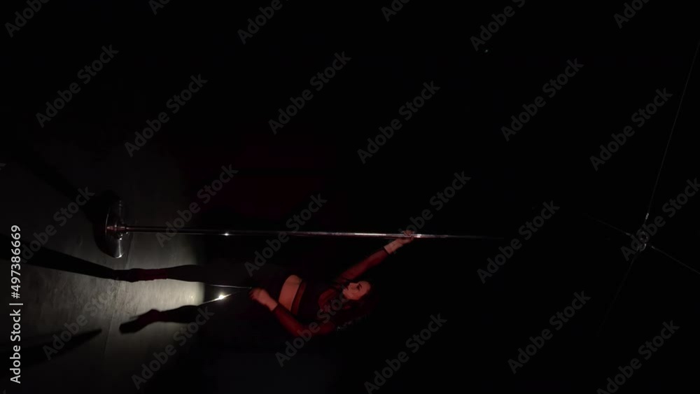 Pole dance. Young beautiful caucasian brunette woman dancer in studio. Pole dance. Young beautiful caucasian brunette woman dancer in studio.