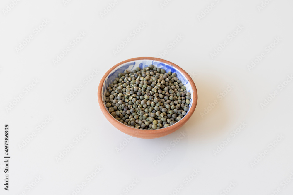 Okra seeds in a clay bowl Okra seeds in a clay bowl