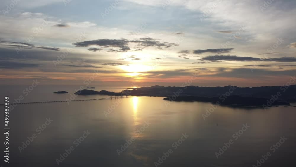 Aerial view panning Second Penang Bridge and island during sunset Aerial view panning Second Penang Bridge and island during sunset