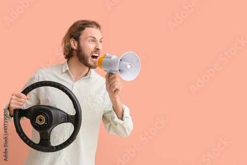Angry man with steering whe...