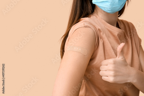 Young woman in mask with ap...