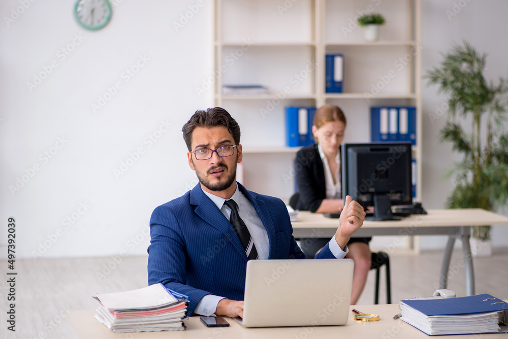 Two colleagues working in the office Two colleagues working in the office