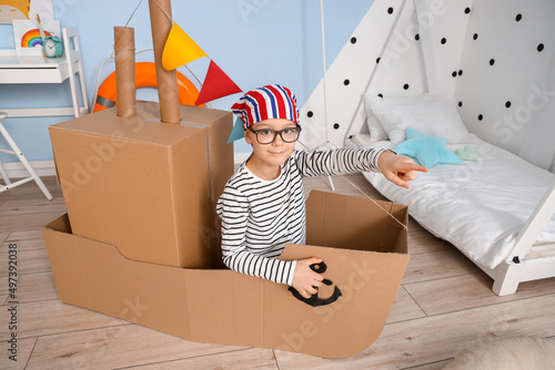 Funny little boy playing wi...