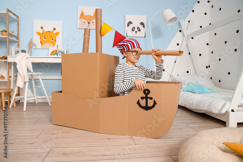 Funny little boy playing wi...