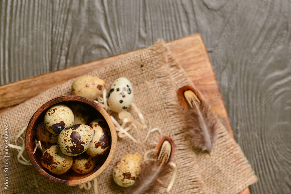 Bowl with fresh quail eggs on brown wooden background Bowl with fresh quail eggs on brown wooden background