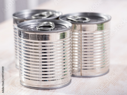 Three silver tin cans closeup. High quality photo