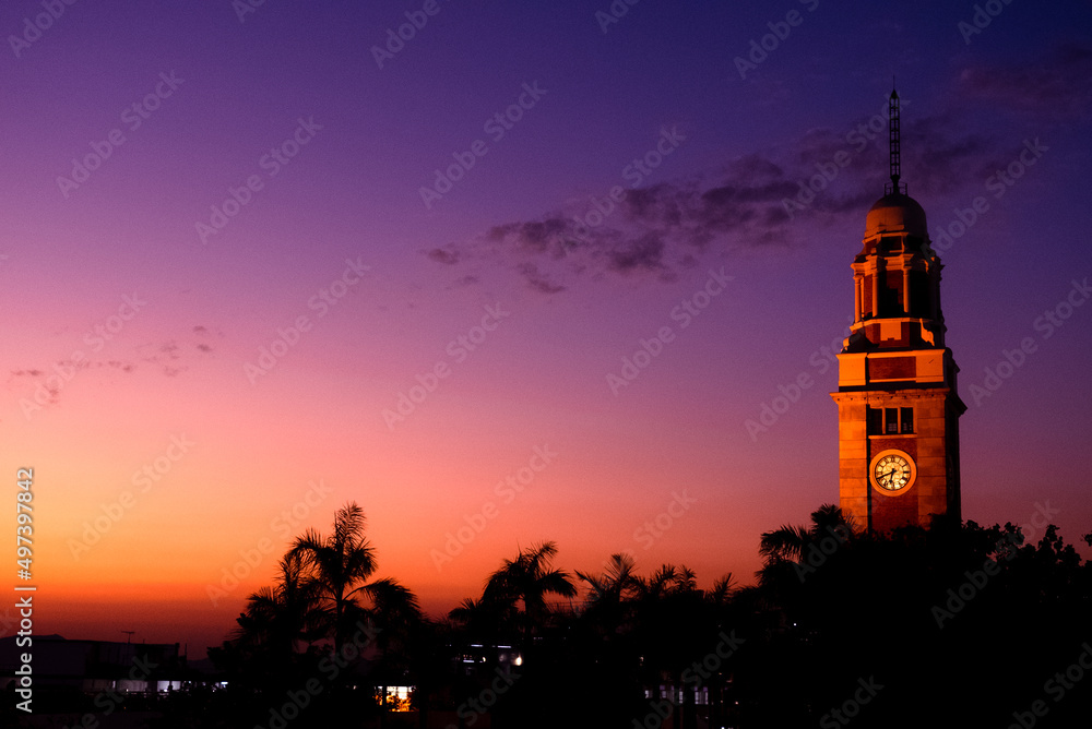 Naklejka premium Clock tower at sunset