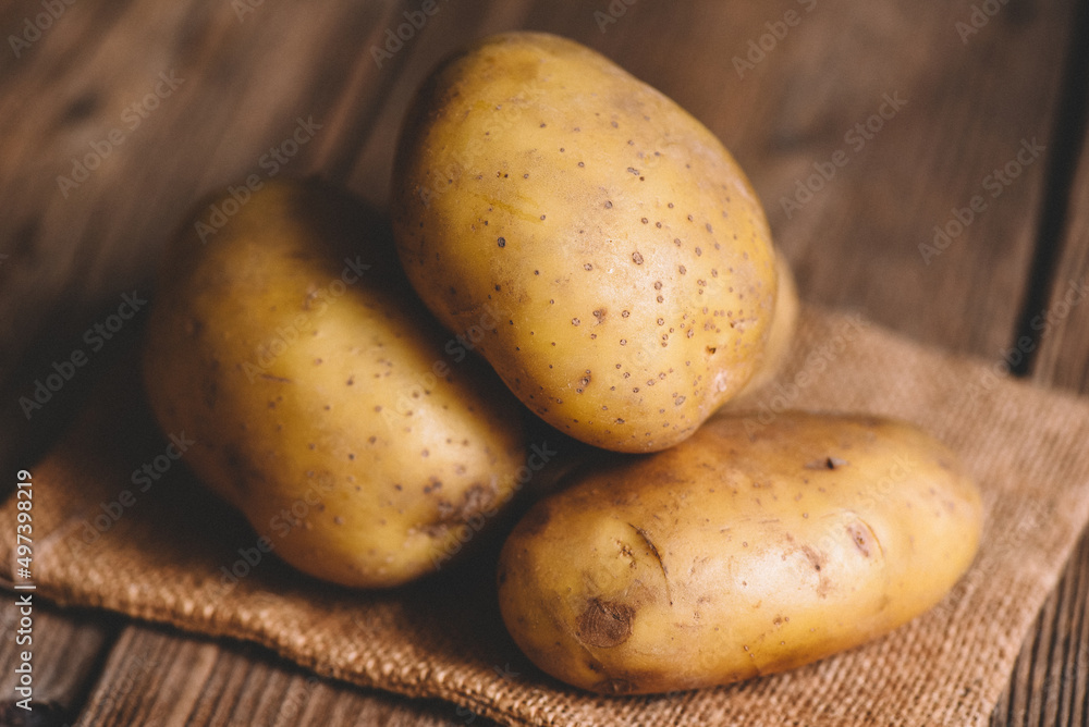 Fresh potato on the sack, ripe potato harvest of potatoes agricultural products for cooking Fresh potato on the sack, ripe potato harvest of potatoes agricultural products for cooking