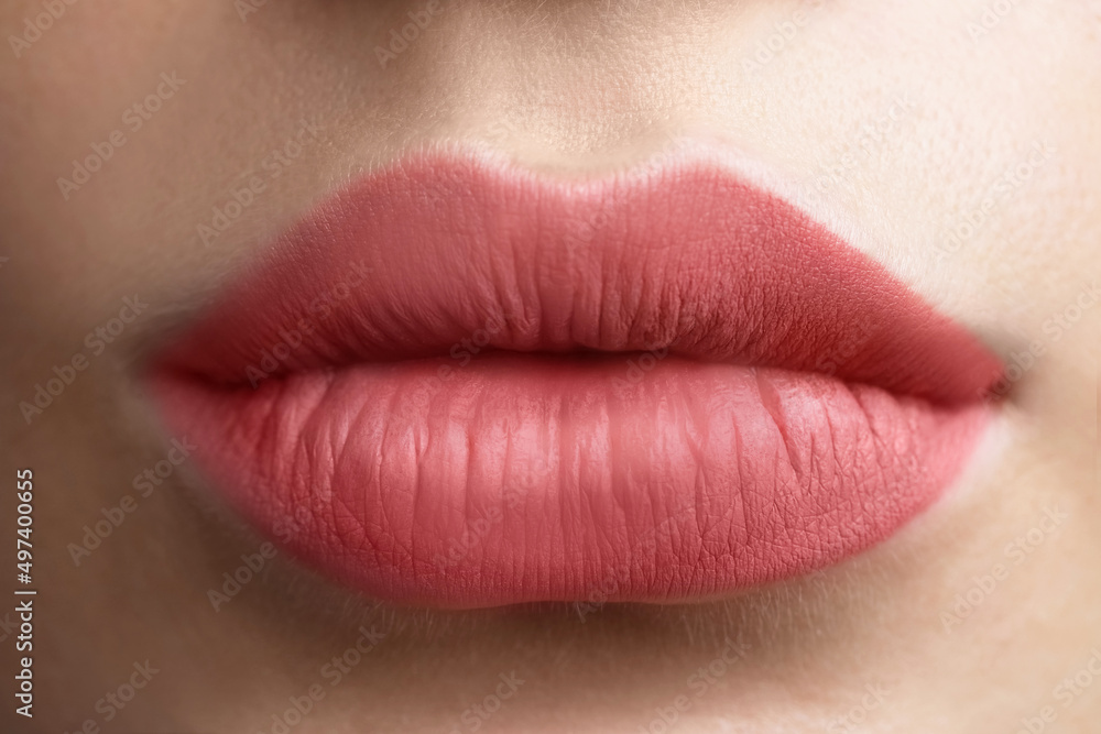 Young woman with beautiful lips, closeup view Young woman with beautiful lips, closeup view