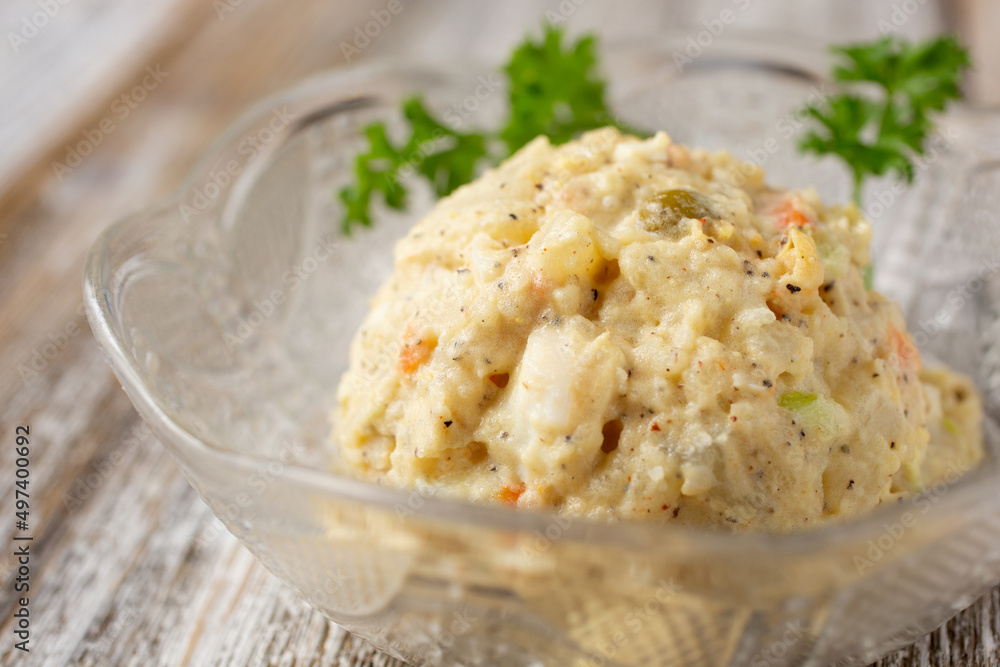 A view of a bowl of Caribbean style potato salad. A view of a bowl of Caribbean style potato salad.