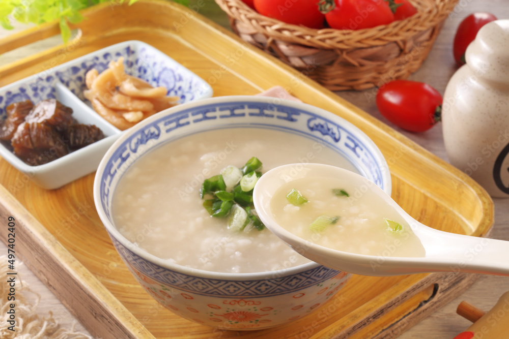 Rice porridge with spring onion on the table Rice porridge with spring onion on the table