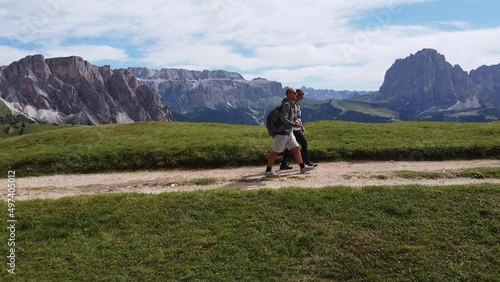 Couple Hiking at Val Gardena Valley and Seceda Mountain in South Tyrol, Italian Alps, Dolomites, Italy photo