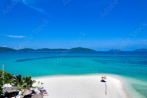 High aerial view of azure waters, white sandy beaches and rich forest nature.