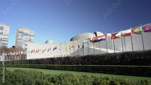 Slow Motion Flags flying in the Wind in front of UN Building in Manhattan. Poland, Russia, Portugal flags slow motion movement in the wind. International community
