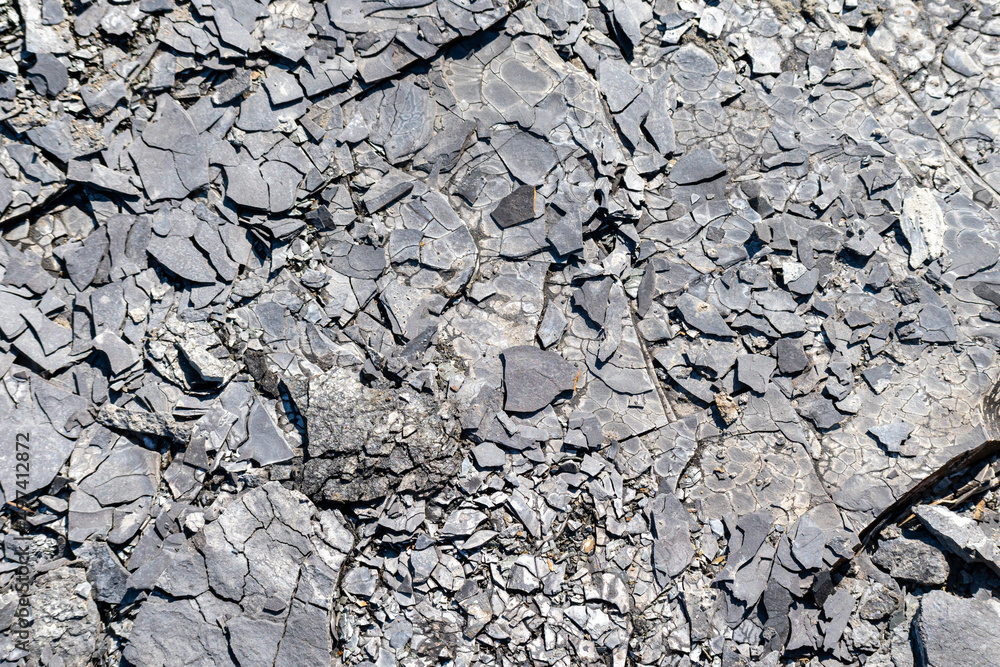 Natural ash with a texture of dark gray black coals. Rock. Space for text. Natural ash with a texture of dark gray black coals. Rock. Space for text.
