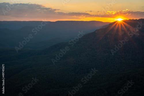 sunset over the mountains. sunset background  © cherdchai