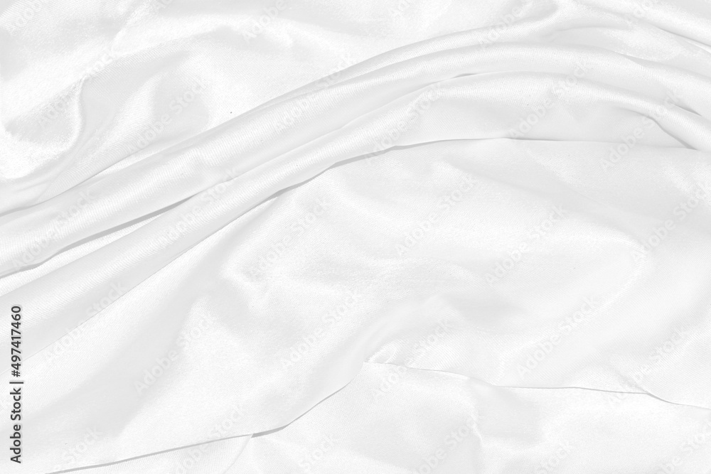 Closeup elegant crumpled of white silk fabric cloth background and texture
