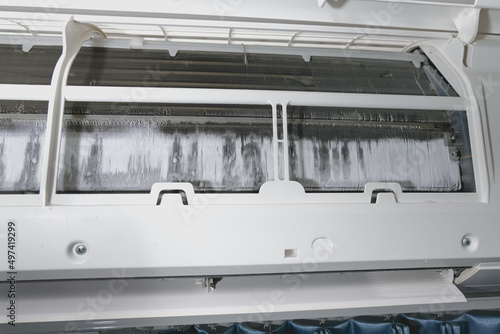 Air conditioner maintenance. Ice on air conditioner.  Service air conditioner. fin of the cooling unit in the air conditioner have a lot of ice and need to repair and service