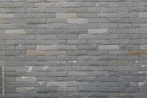 Surface of Vintage grey brick wall background.