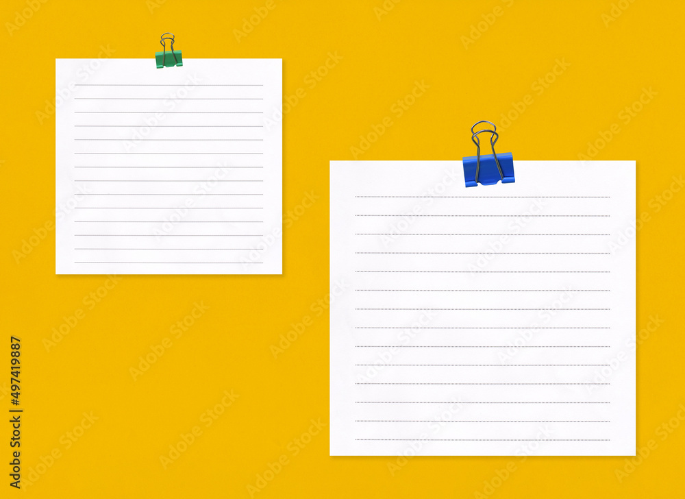 Blank note paper with clip on yellow art paper background. Blank note paper with clip on yellow art paper background.