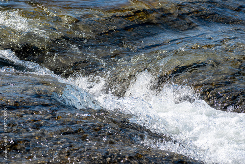 Mountain river in the mountains of Ukraine. Peremiyskaya river, Ivano-Frankivsk region. Spring 2022.