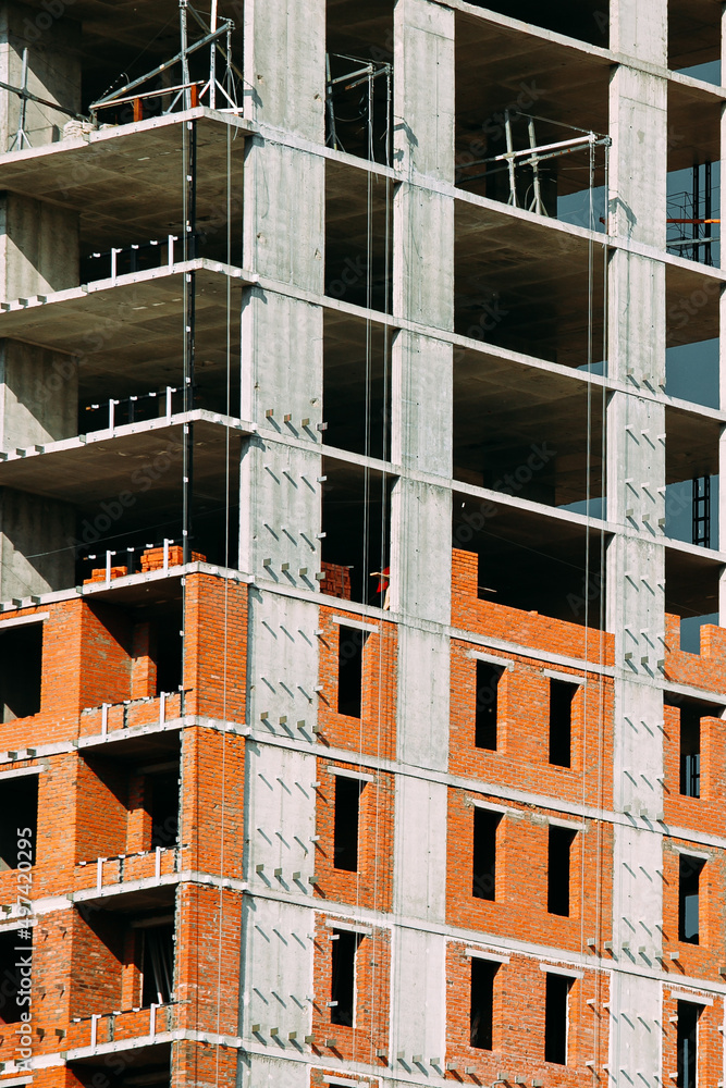 fragment of a high-rise residential and office building under construction fragment of a high-rise residential and office building under construction