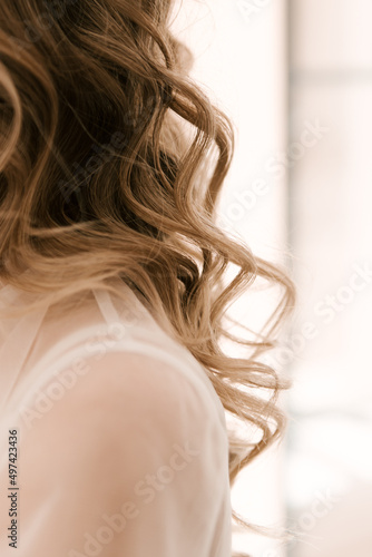 Morning of the bride, details of the wedding day, beautiful curls close-up