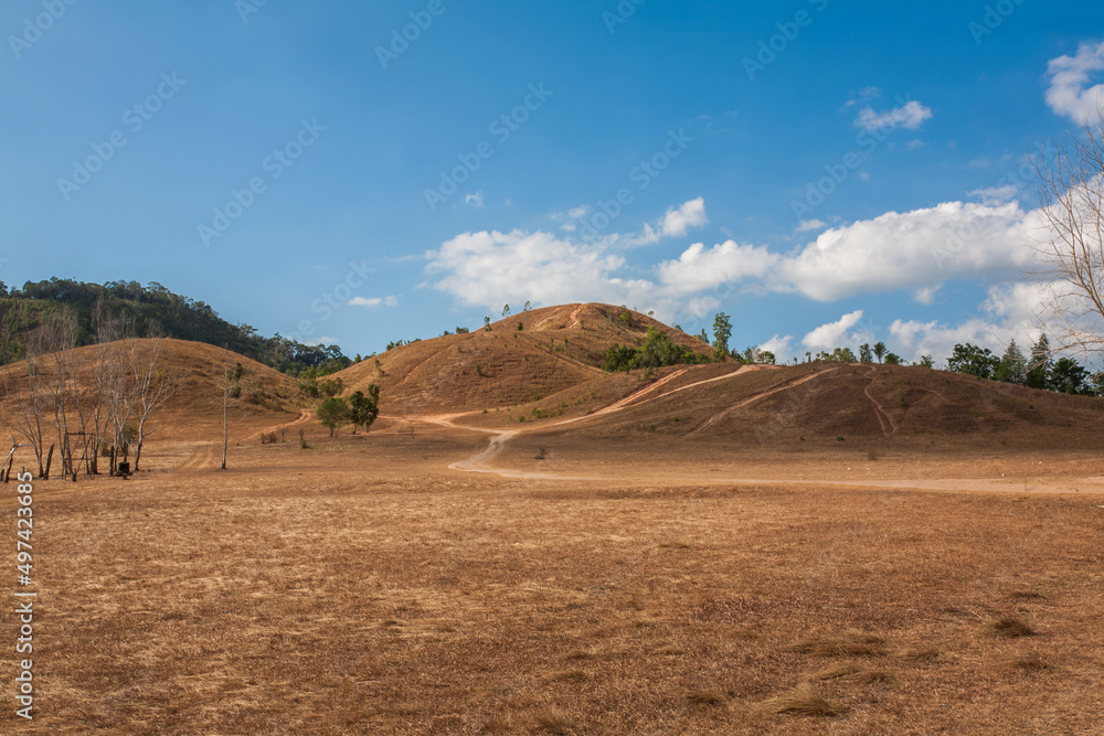 Phu Khao Ya Mountain in Ranong Province, Thailand, is Mysteriously treeless, grassy hill popular for picnics and kite-flying with panoramic mountain vistas