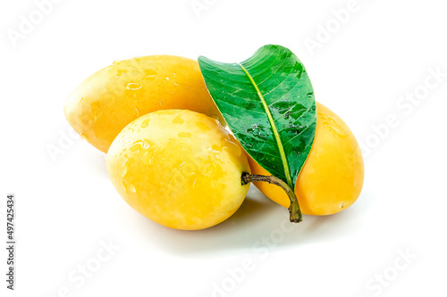 Marian Plum, Plum Mango, yellow fresh fruit and green leaf. Summer fruit with a sweet and sour taste. isolated on white background. photo