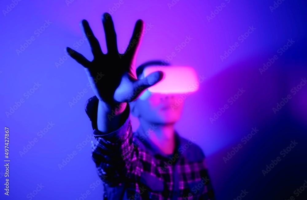 Asian man wearing virtual reality goggles, Future technology concept. Asian man wearing virtual reality goggles, Future technology concept.