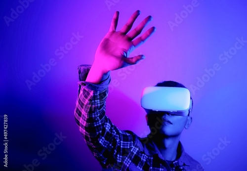 Asian man wearing virtual reality goggles  Future technology concept.