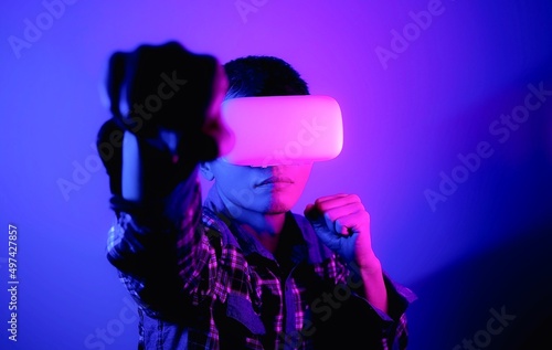 Asian man wearing virtual reality goggles, Future technology concept.