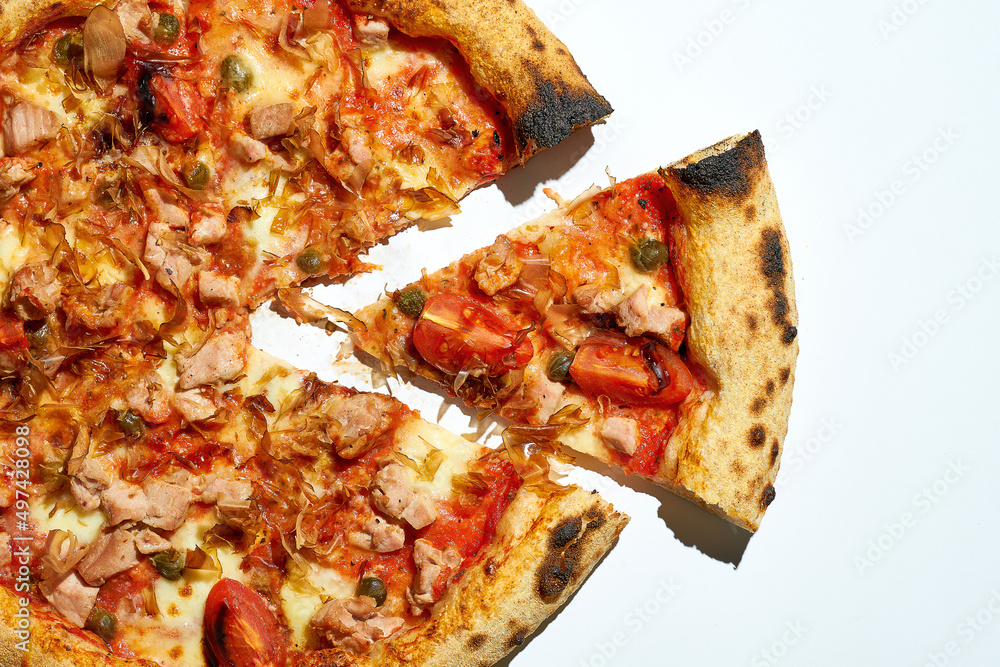 Sliced Pizza with tomatoes, chicken and white sauce isolated on white background Sliced Pizza with tomatoes, chicken and white sauce isolated on white background
