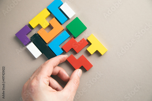 hand connecting geometric shape block