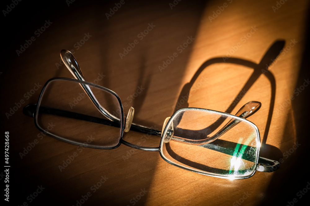 Glasses for sight lie on the office table close-up. Glasses for sight lie on the office table close-up.