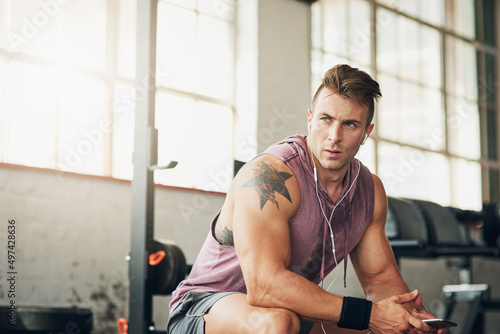 The time to get ripped is now. Shot of a handsome young man at the gym.